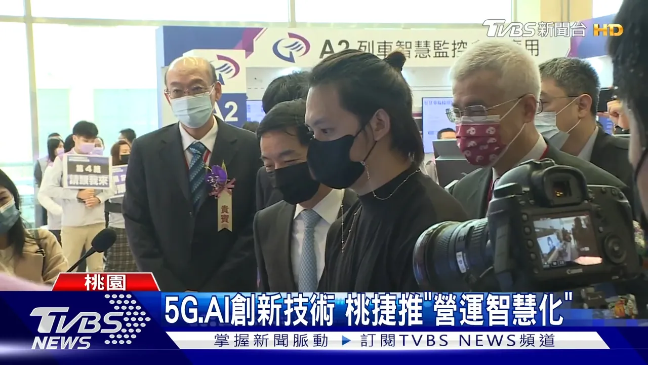 TVBS News footage: me in a black turtleneck explaining the system at a Taoyuan Metro exhibition booth